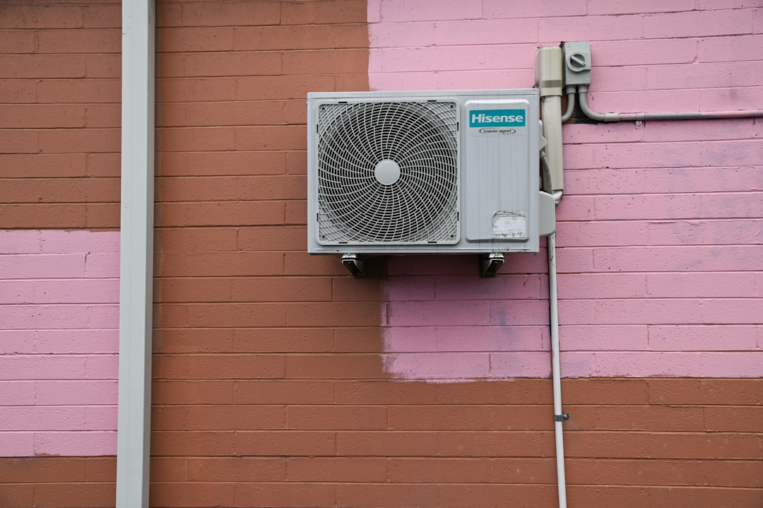 Home a-air-conditioner-mounted-to-the-side-of-a-building-gpvqqep5qnw