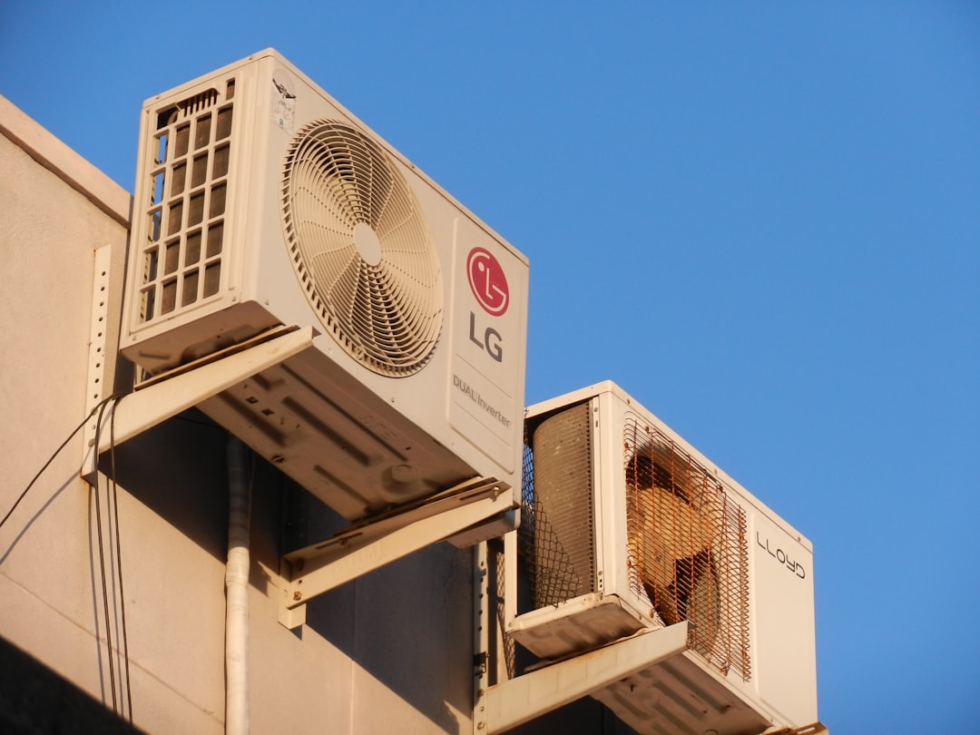Home a-large-air-conditioner-mounted-on-the-side-of-a-building-iahgeyhqp4u